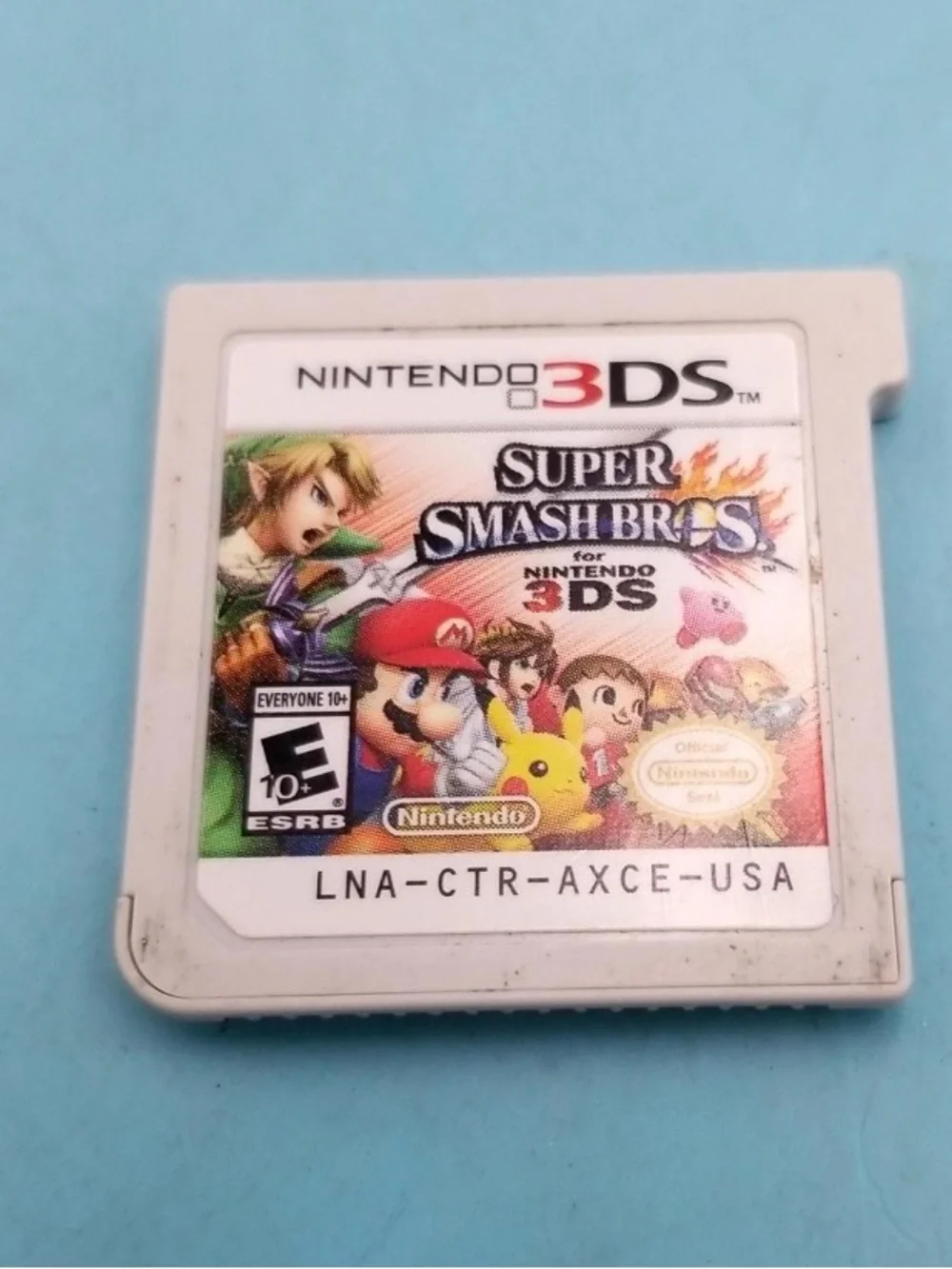 Nintendo 2DS White Handheld Console with Gray Charger and Game Card